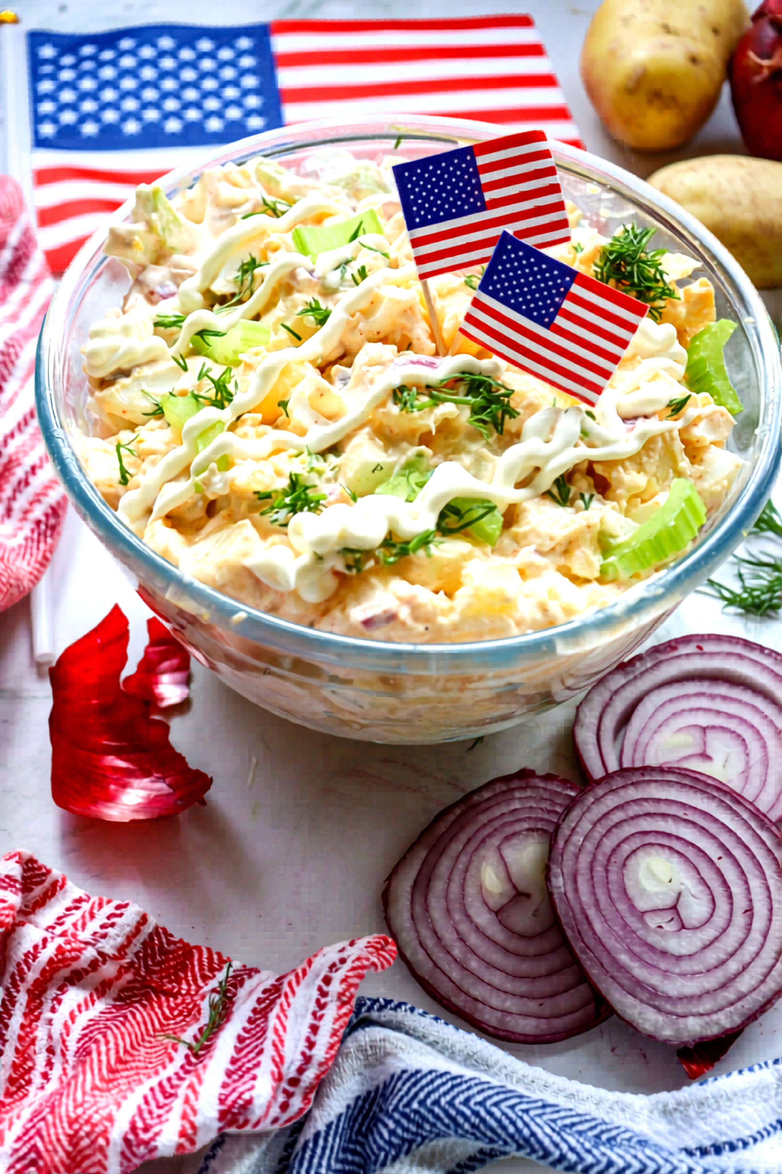 Serving angle of classic potato salad with mini American flags