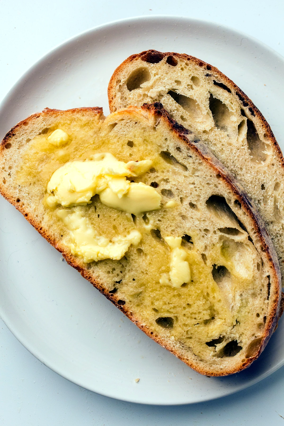 Buttered slices of artisan sourdough loaf