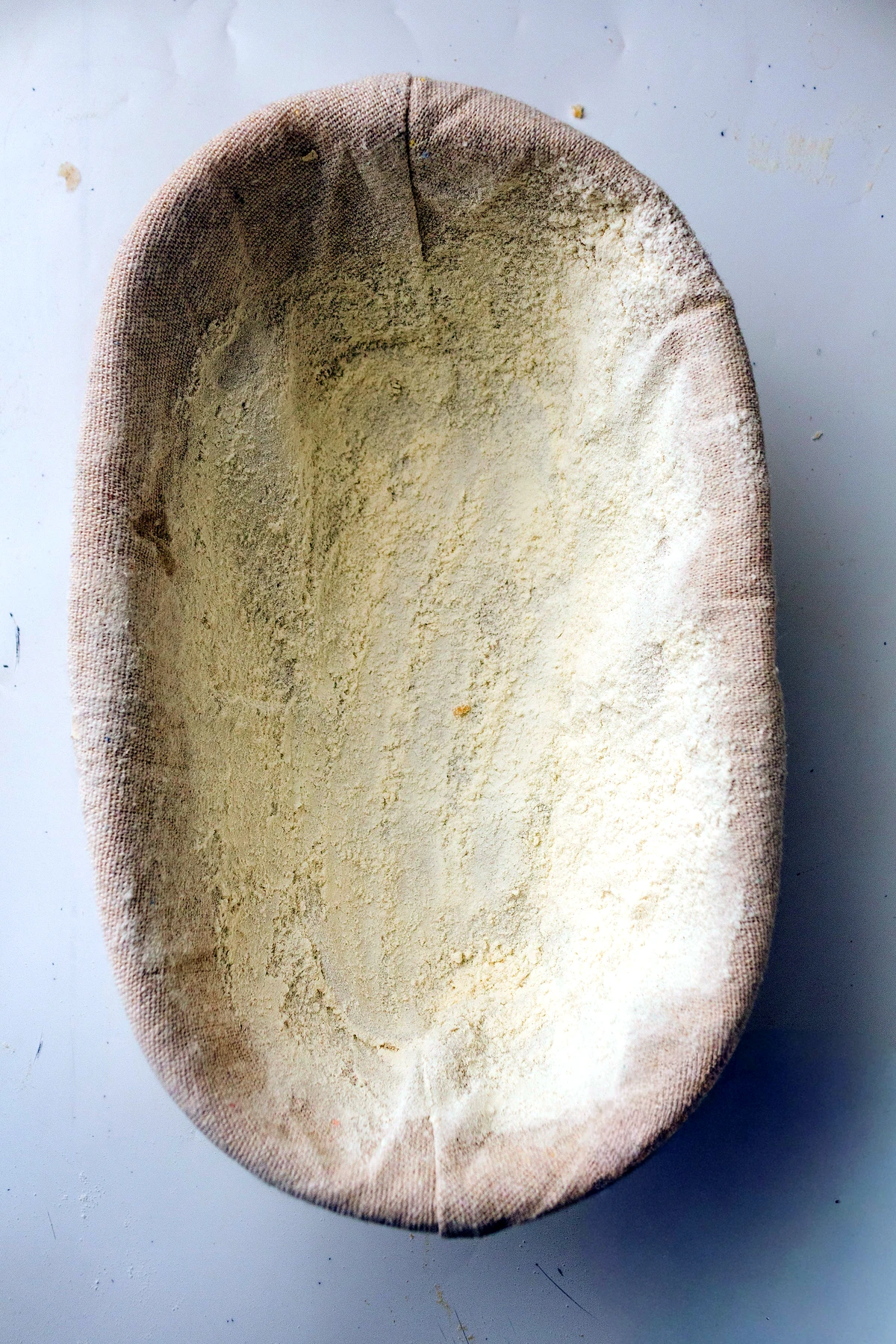 Proofed artisan sourdough loaf in a banneton