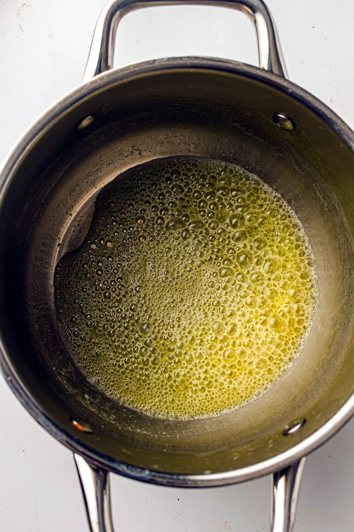 Melted butter in a pot for mac and cheese sauce
