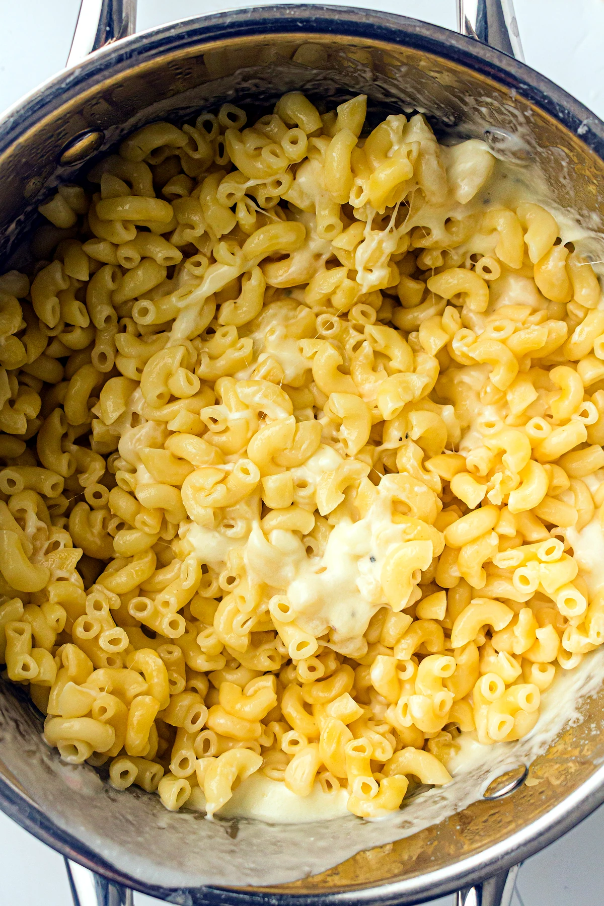 Macaroni mixed with cheese sauce