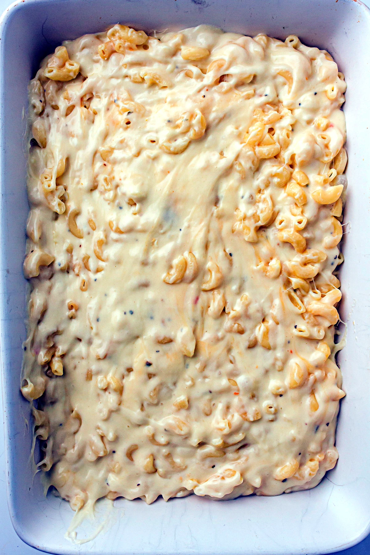Mac and cheese spread in a baking dish