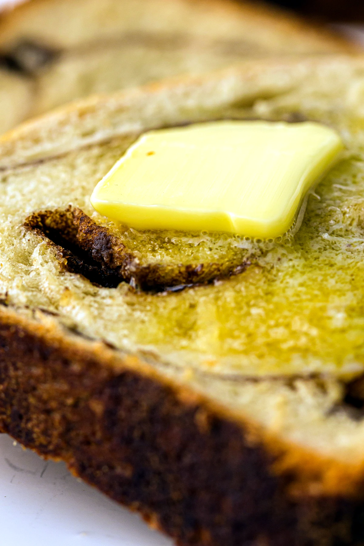 Buttered slice of cinnamon swirl bread