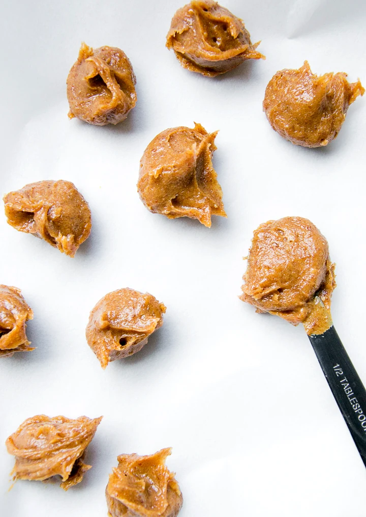 Scooping date mixture onto a lined plate