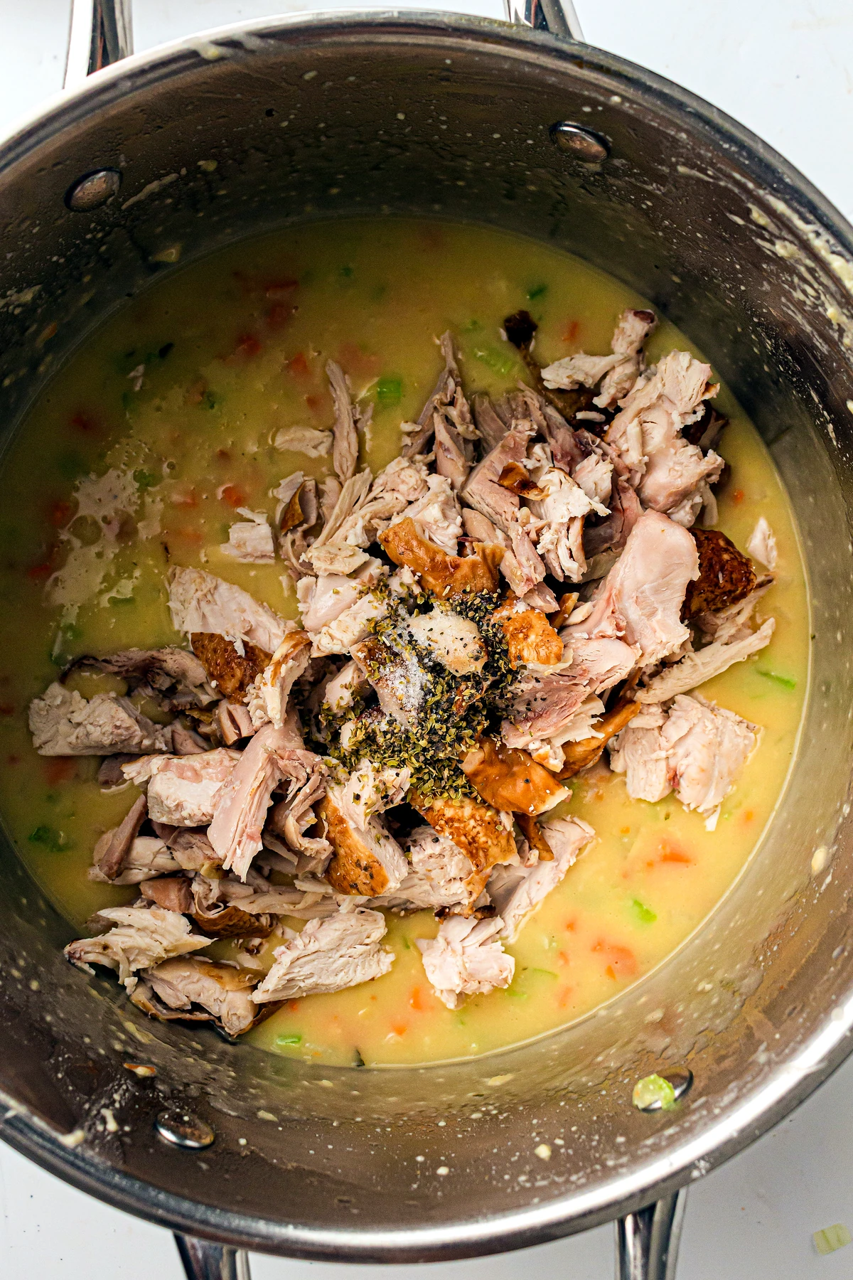 Cooked chicken added to creamy pot pie filling