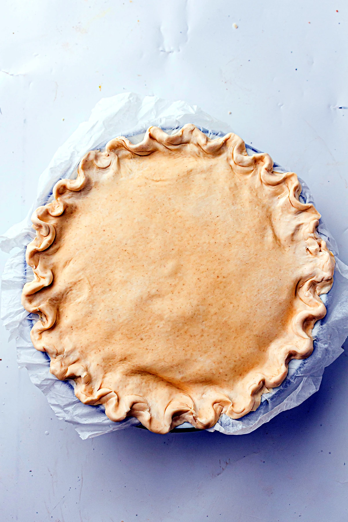 Top crust added and crimped on chicken pot pie