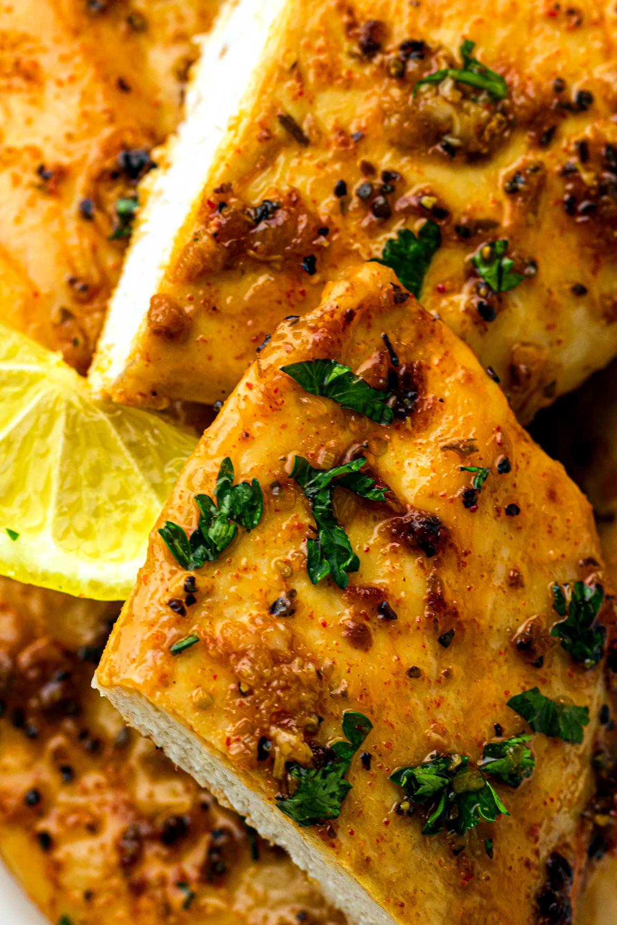 Single baked lemon chicken breast close up
