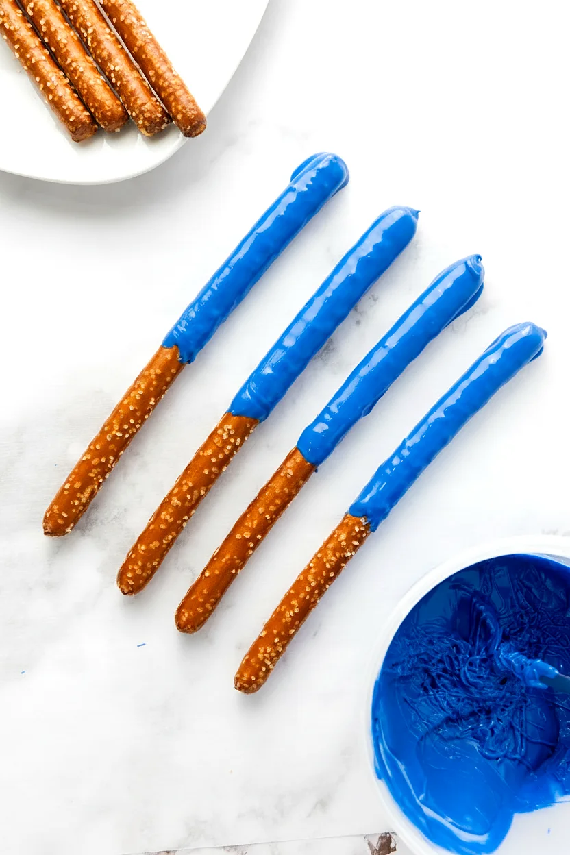 Pretzel rods dipped in blue candy coating