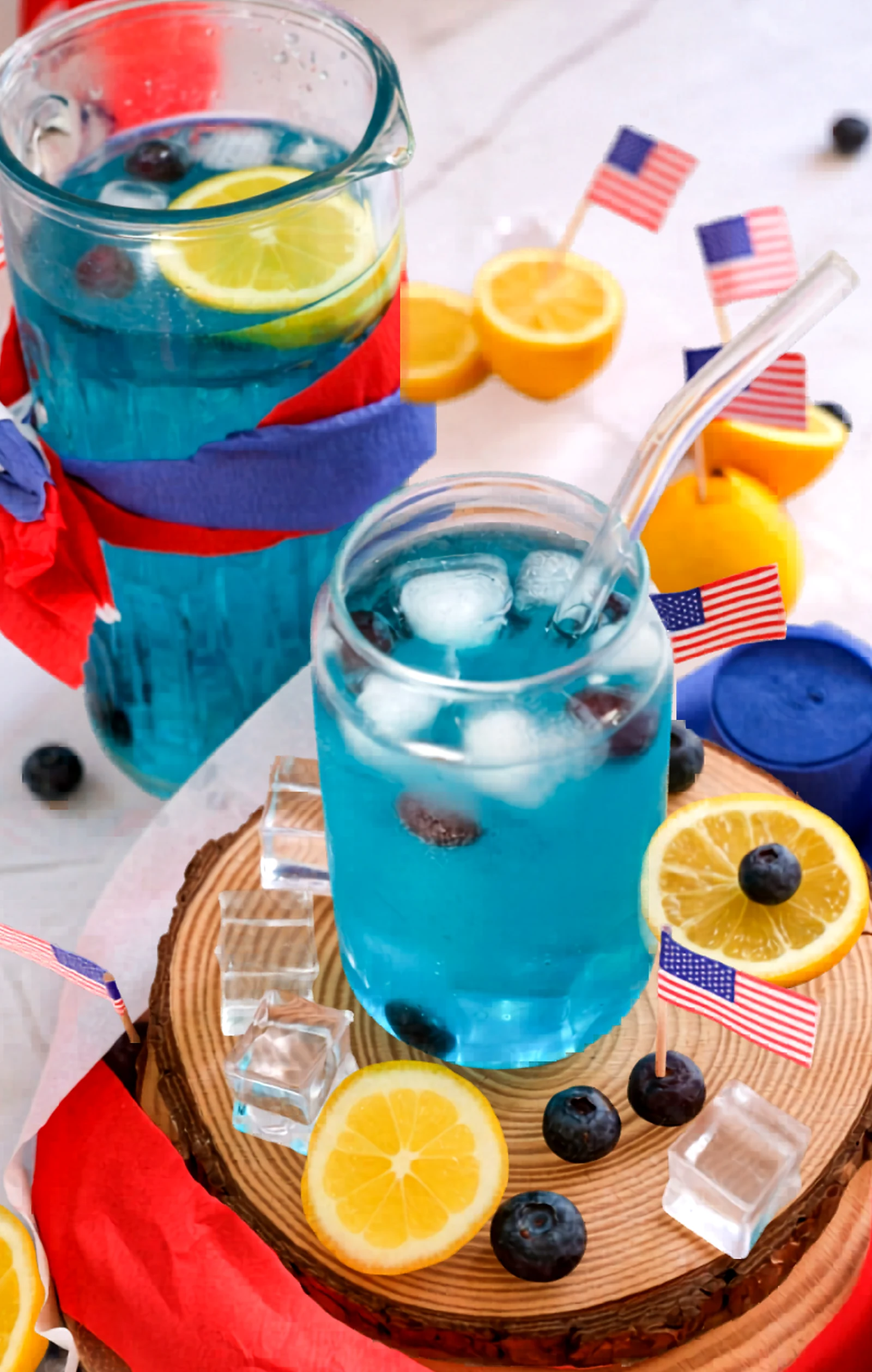 Blue curacao mocktail served in a pitcher and glass.