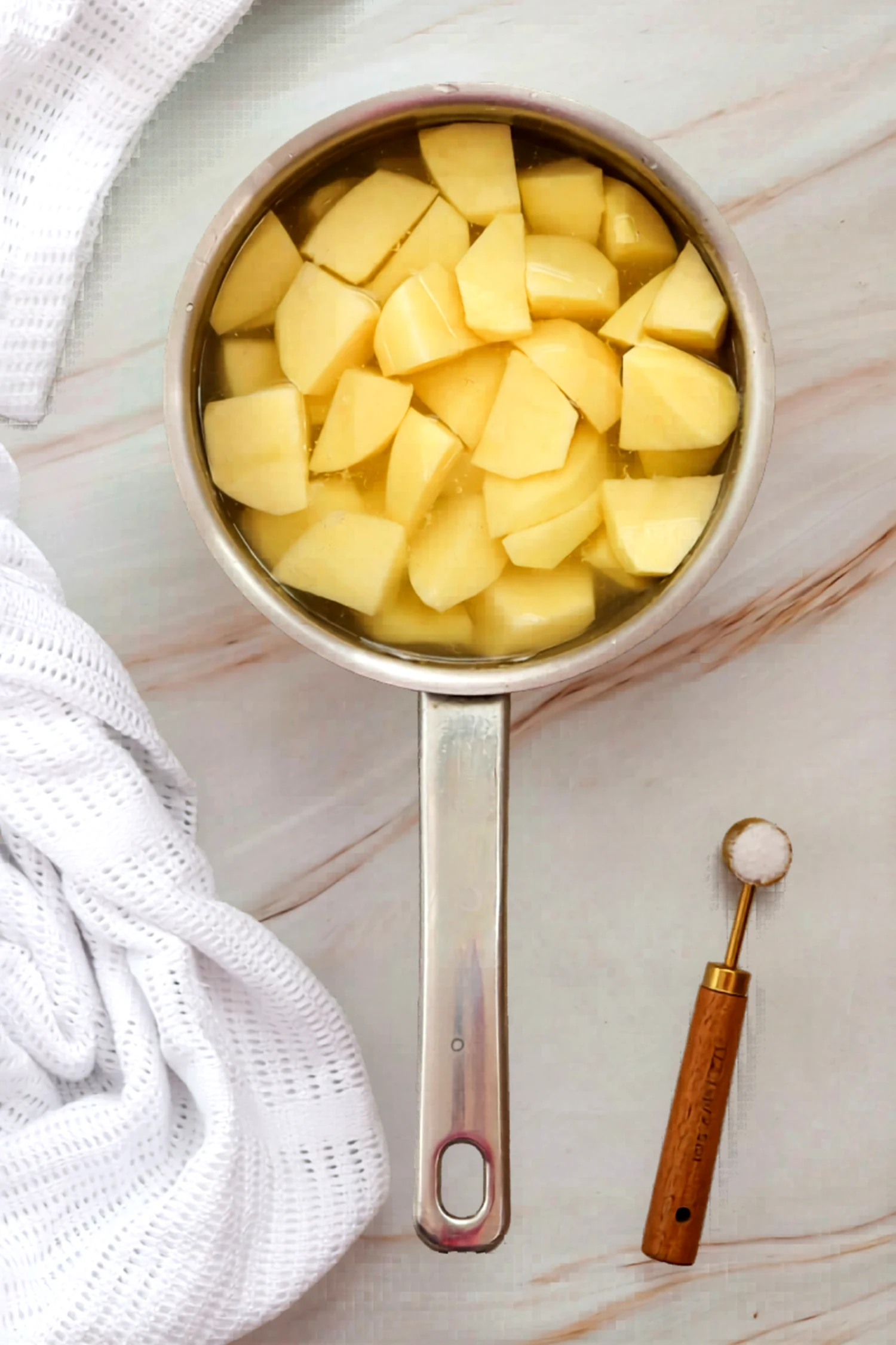 Potato chunks cooking in a pot