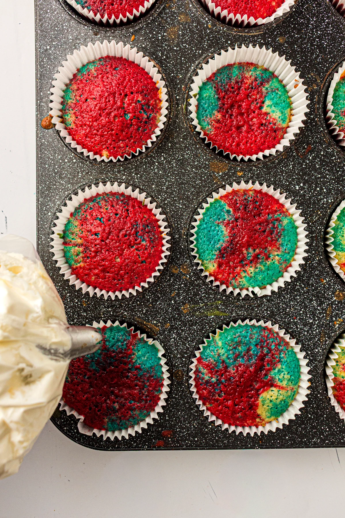 Cooled tie-dye cupcakes ready for frosting