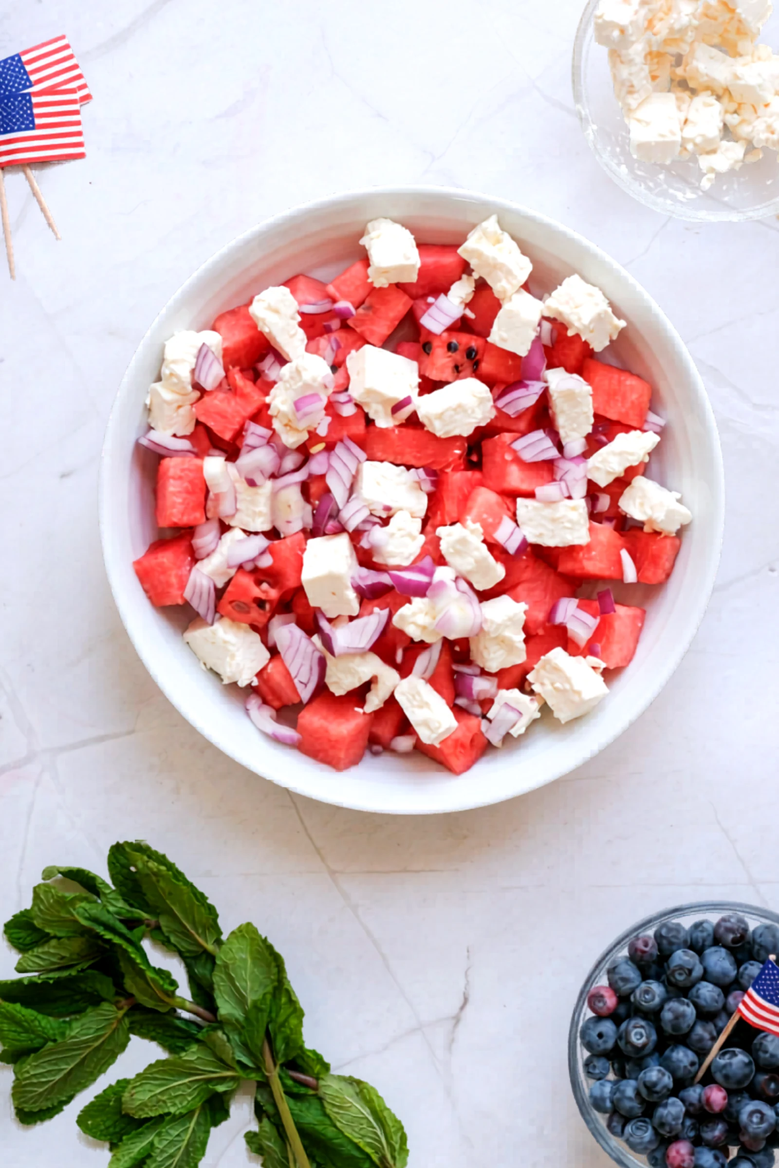 Blueberries and red onion added to the watermelon salad