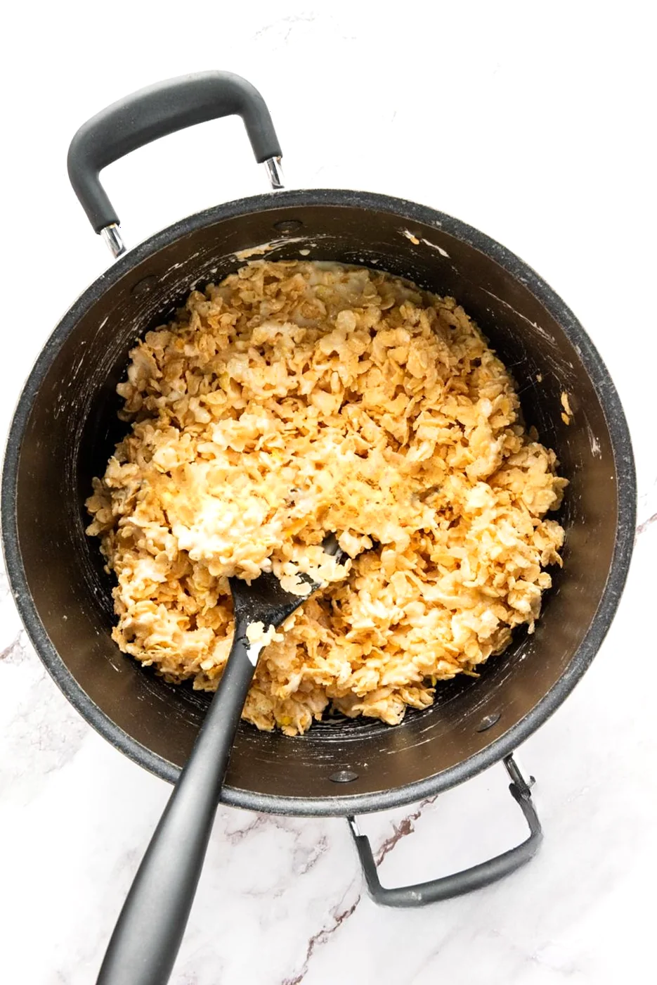 Crispy rice cereal mixed into melted marshmallows