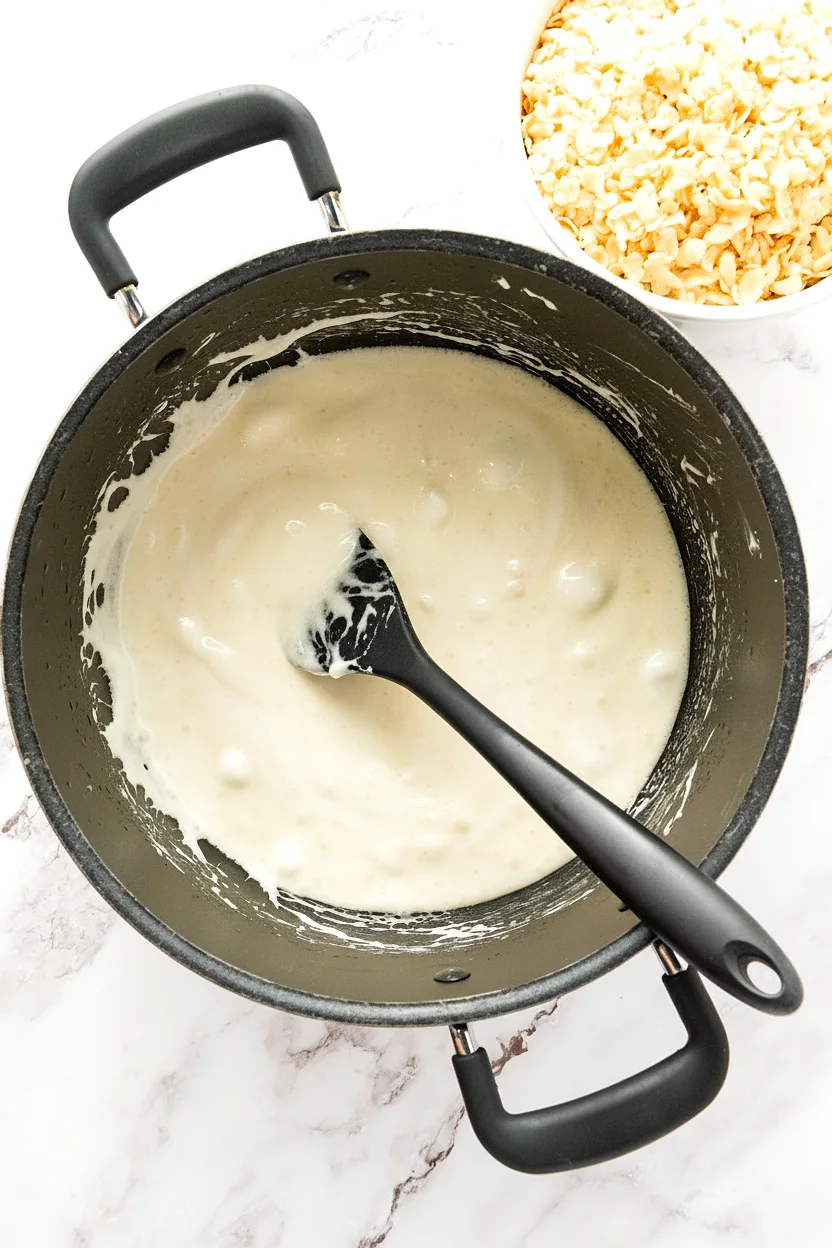 Melted marshmallow mixture stirred smooth
