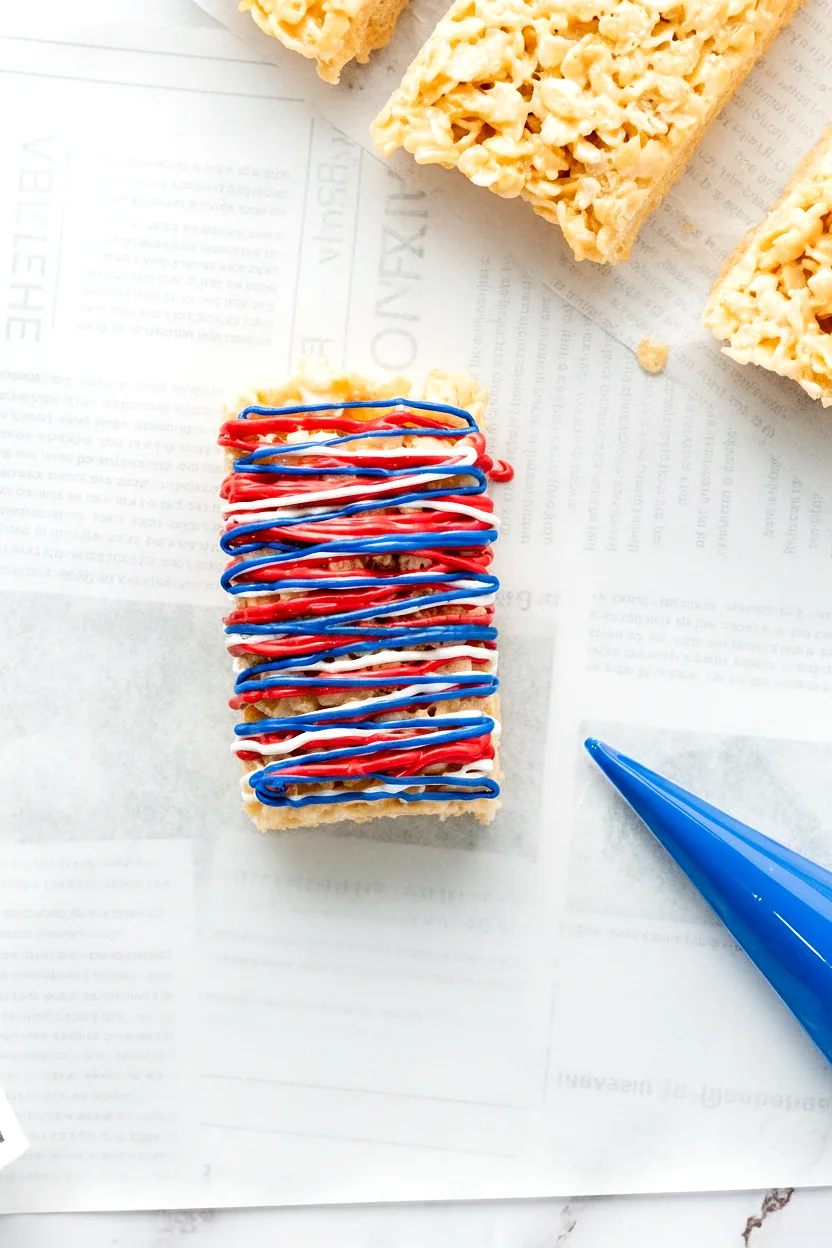 Rice Krispie treat with red white and blue drizzle