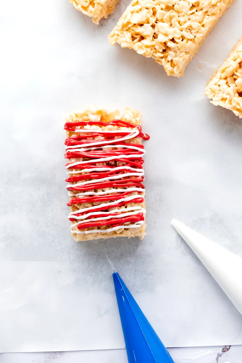 Rice Krispie treat with red and white drizzle
