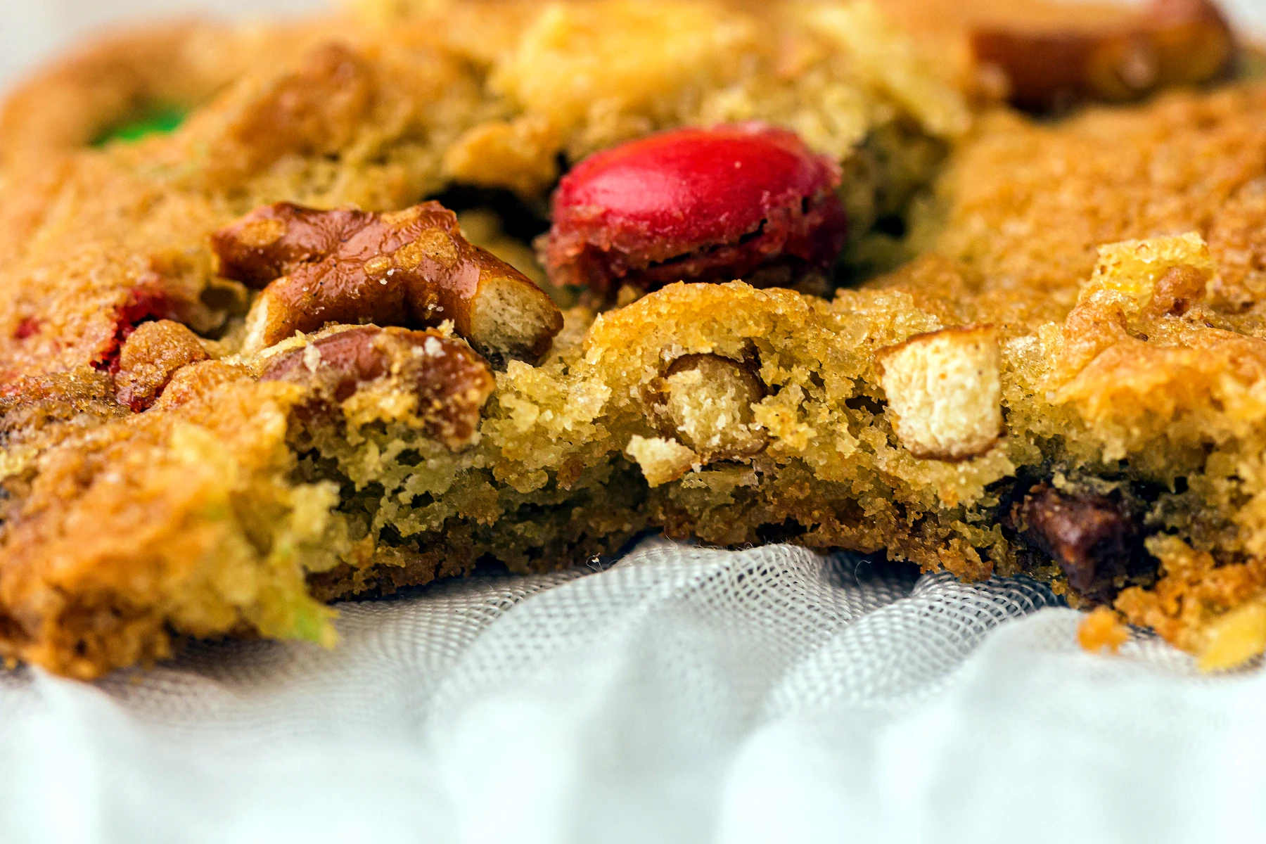 Broken open kitchen sink cookie showing mix-ins