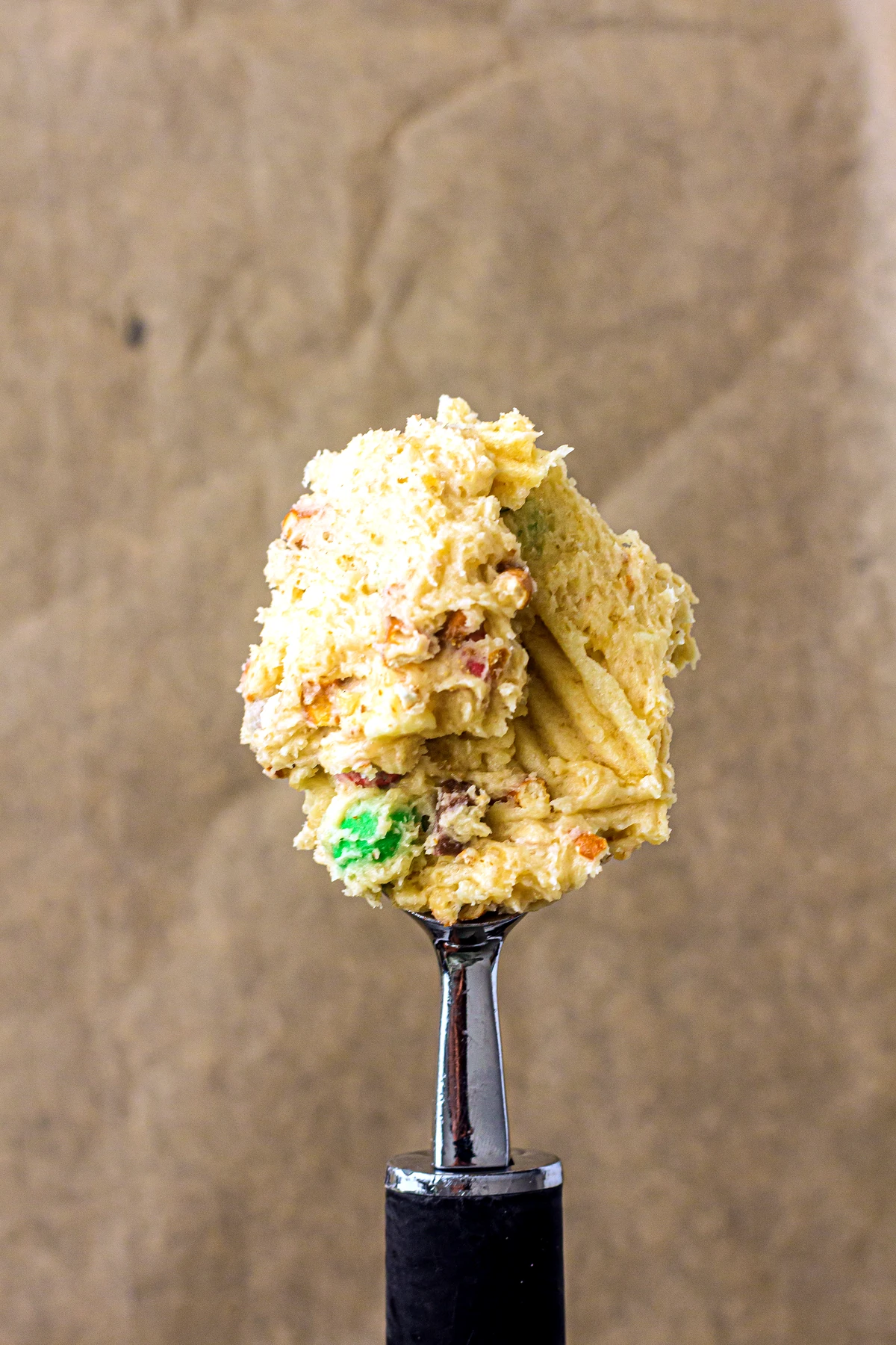 Scooped kitchen sink cookie dough on a baking sheet