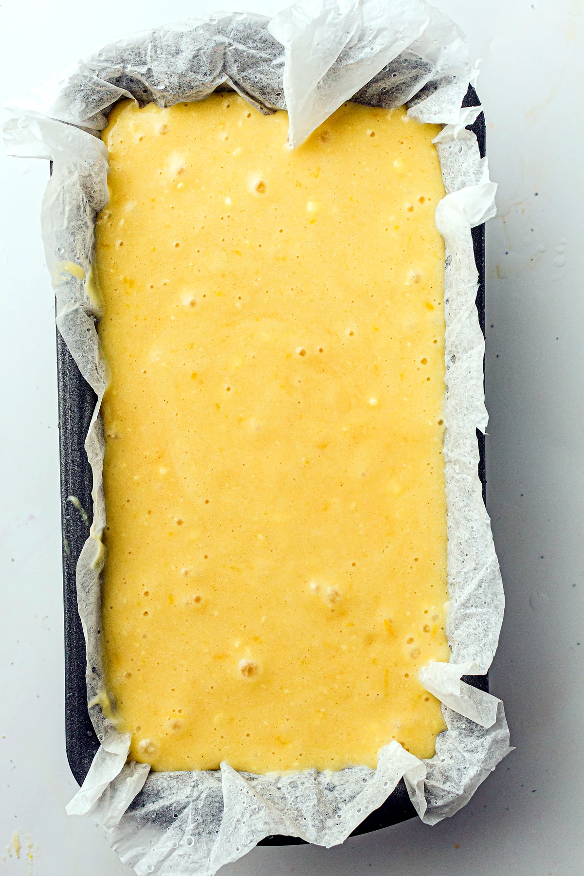 Lemon pound cake batter in loaf pan