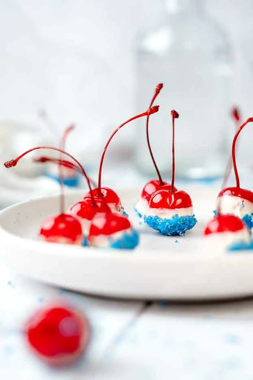 Patriotic boozy cherry bombs served on a plate