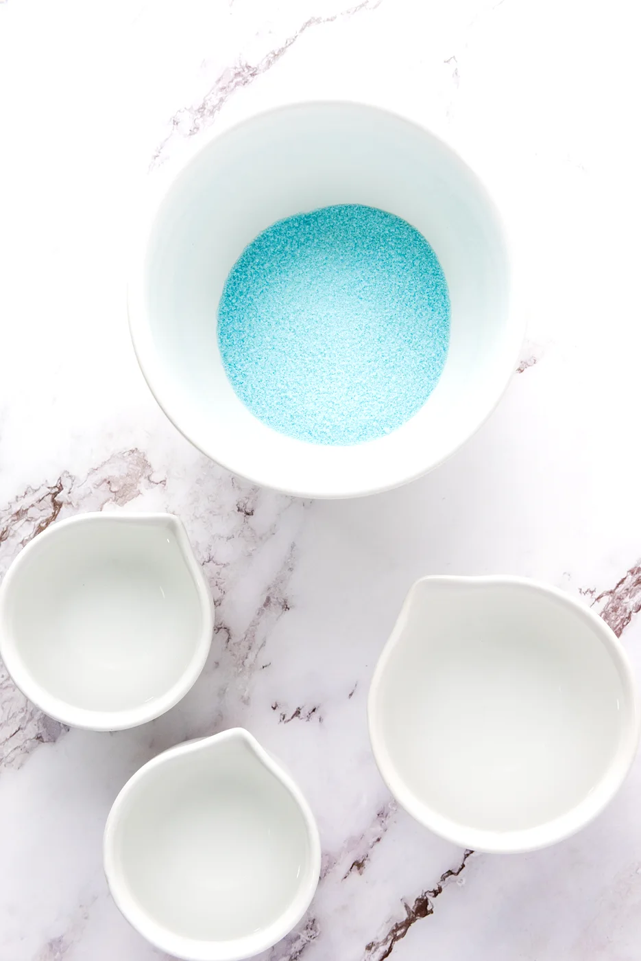 Blue gelatin powder in a bowl for the first layer