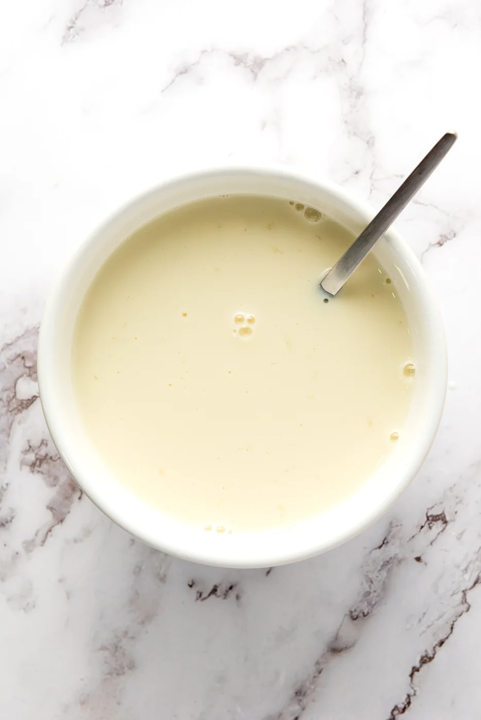 Creamy white gelatin mixture ready to pour