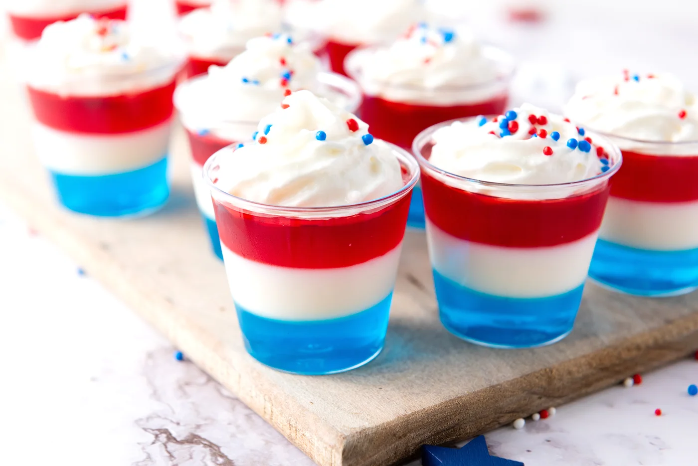 Patriotic Jell-O shots arranged on a serving board