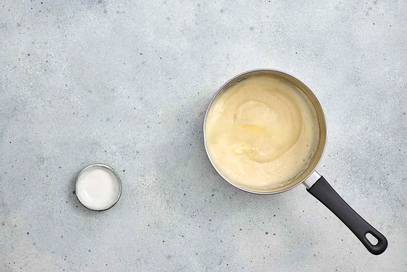 Milk warming in a saucepan for vanilla custard