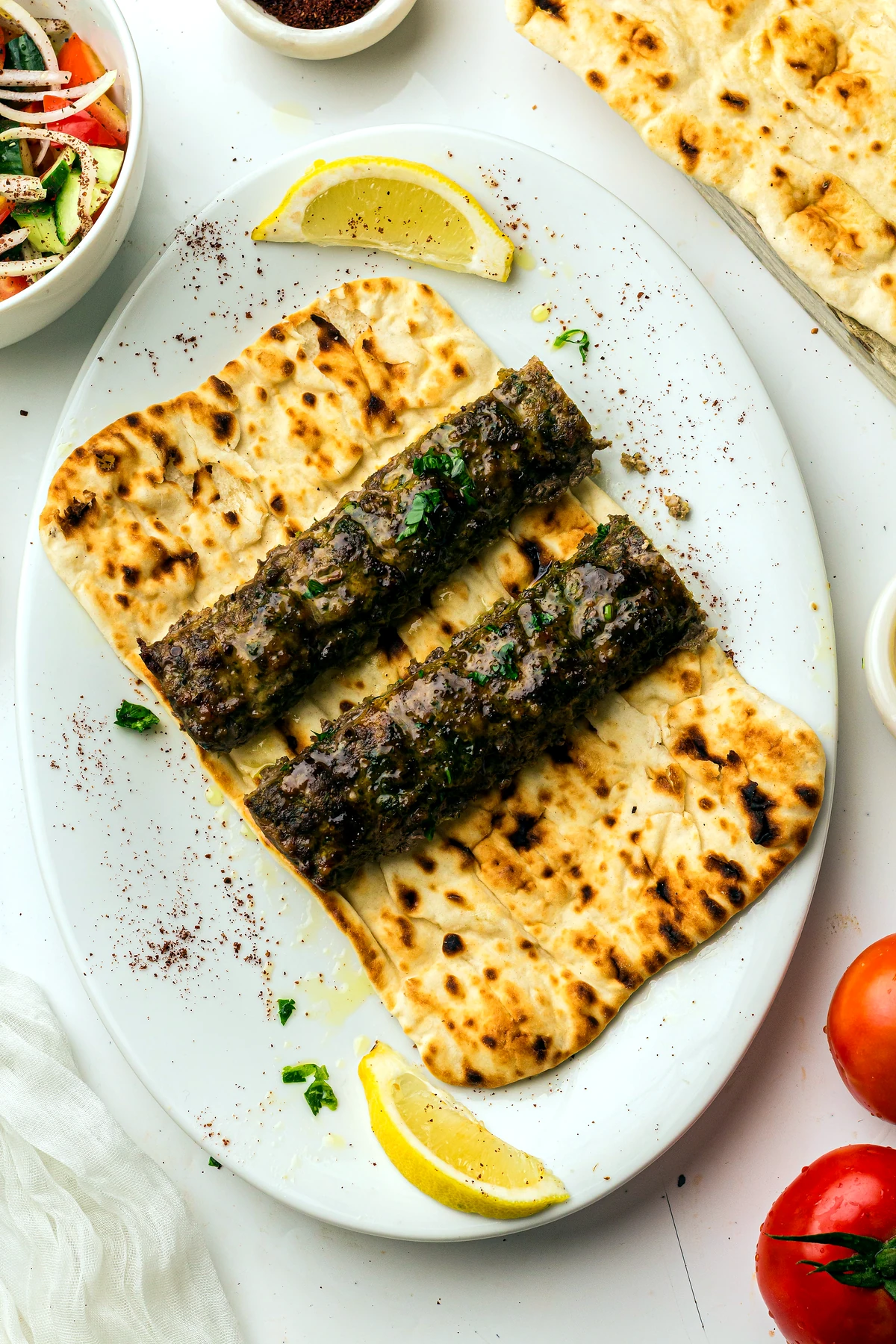 Sheet pan koftas served on flatbread