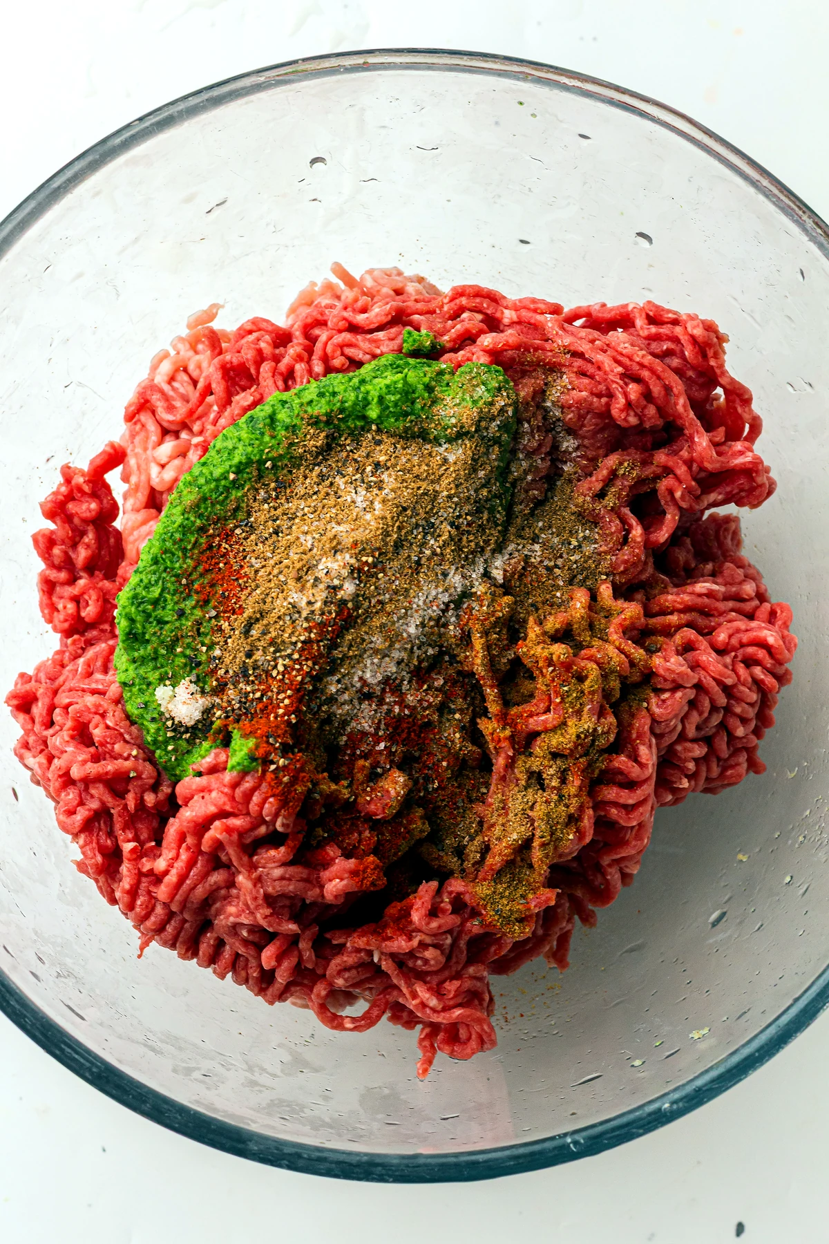 Ground beef topped with herb mixture and spices
