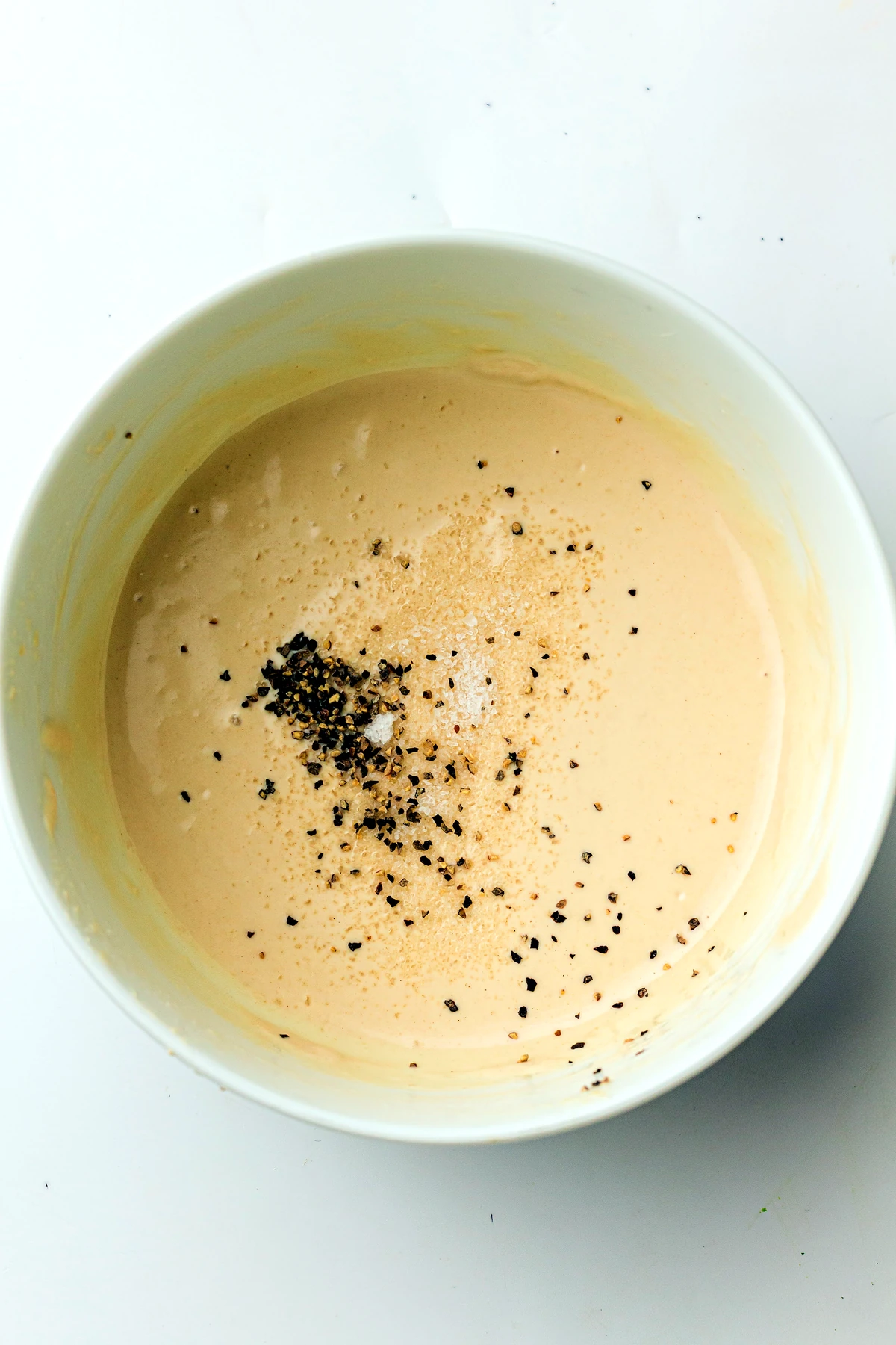 Tahini dressing whisked in a bowl