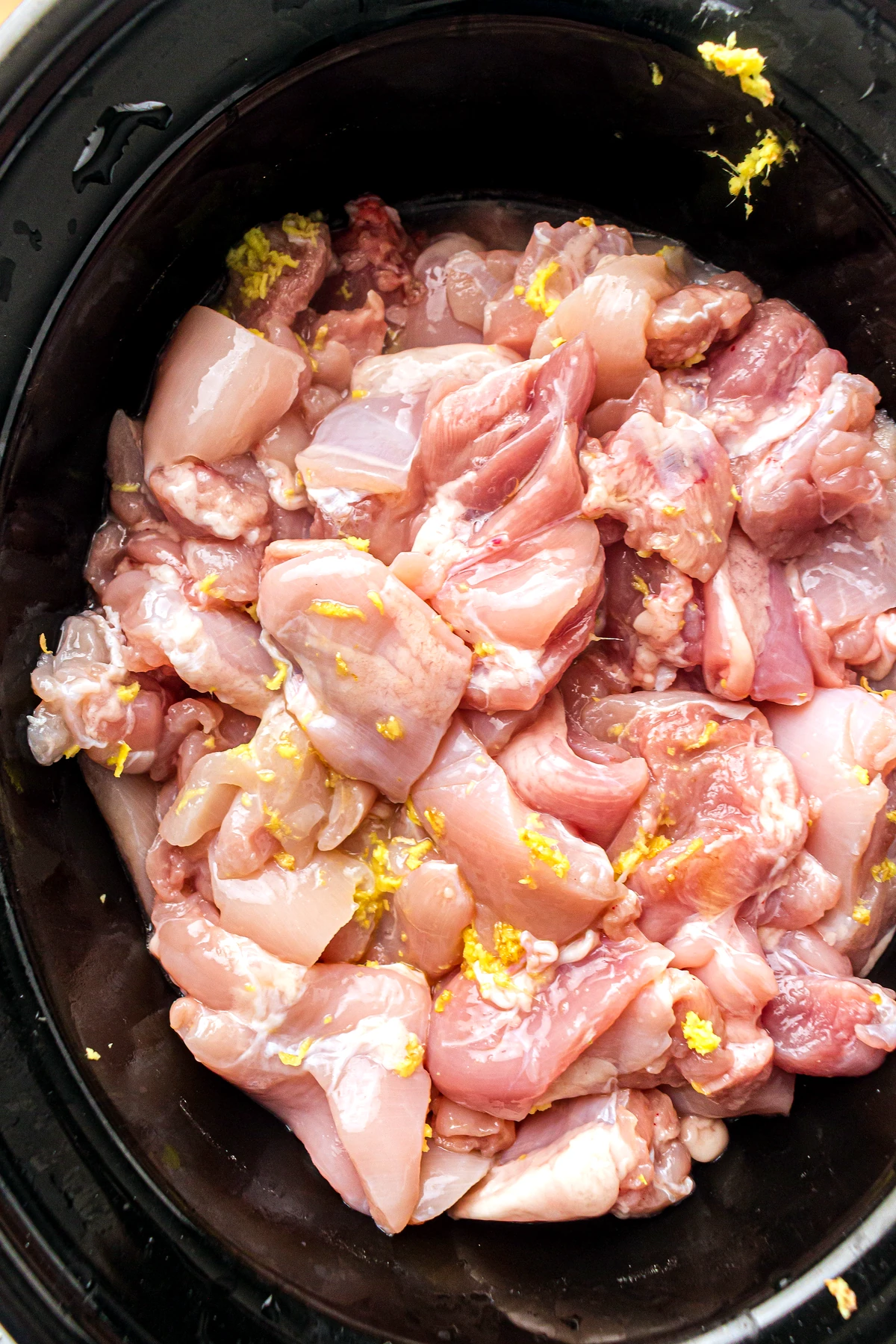 Chicken thighs added to slow cooker