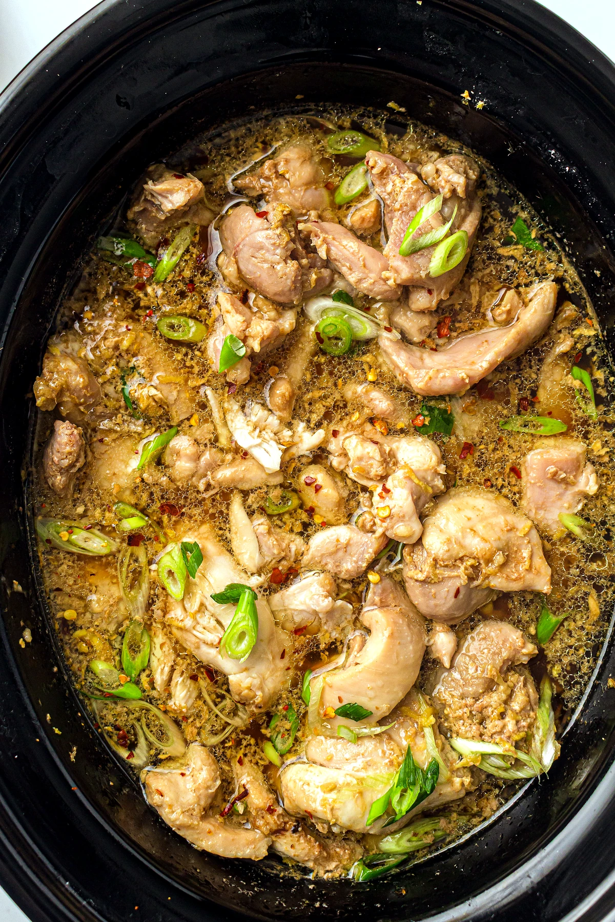 Finished slow cooker honey garlic chicken in the pot