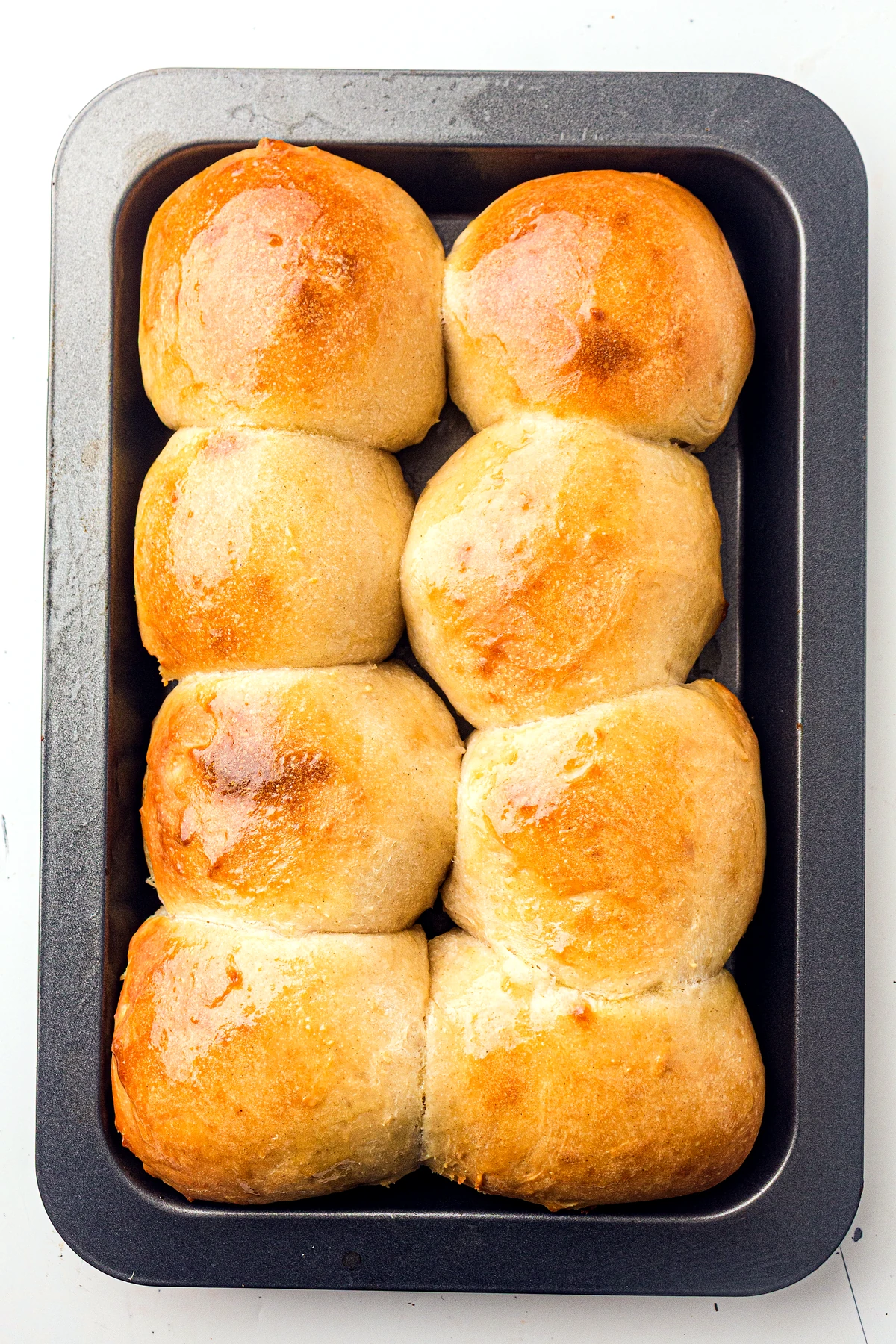 Sourdough dinner rolls brushed with butter