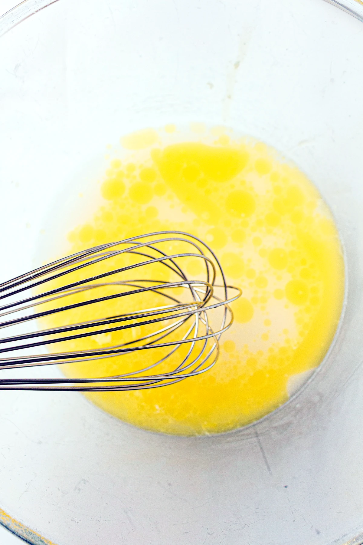 Honey and melted butter added to sourdough roll mixture
