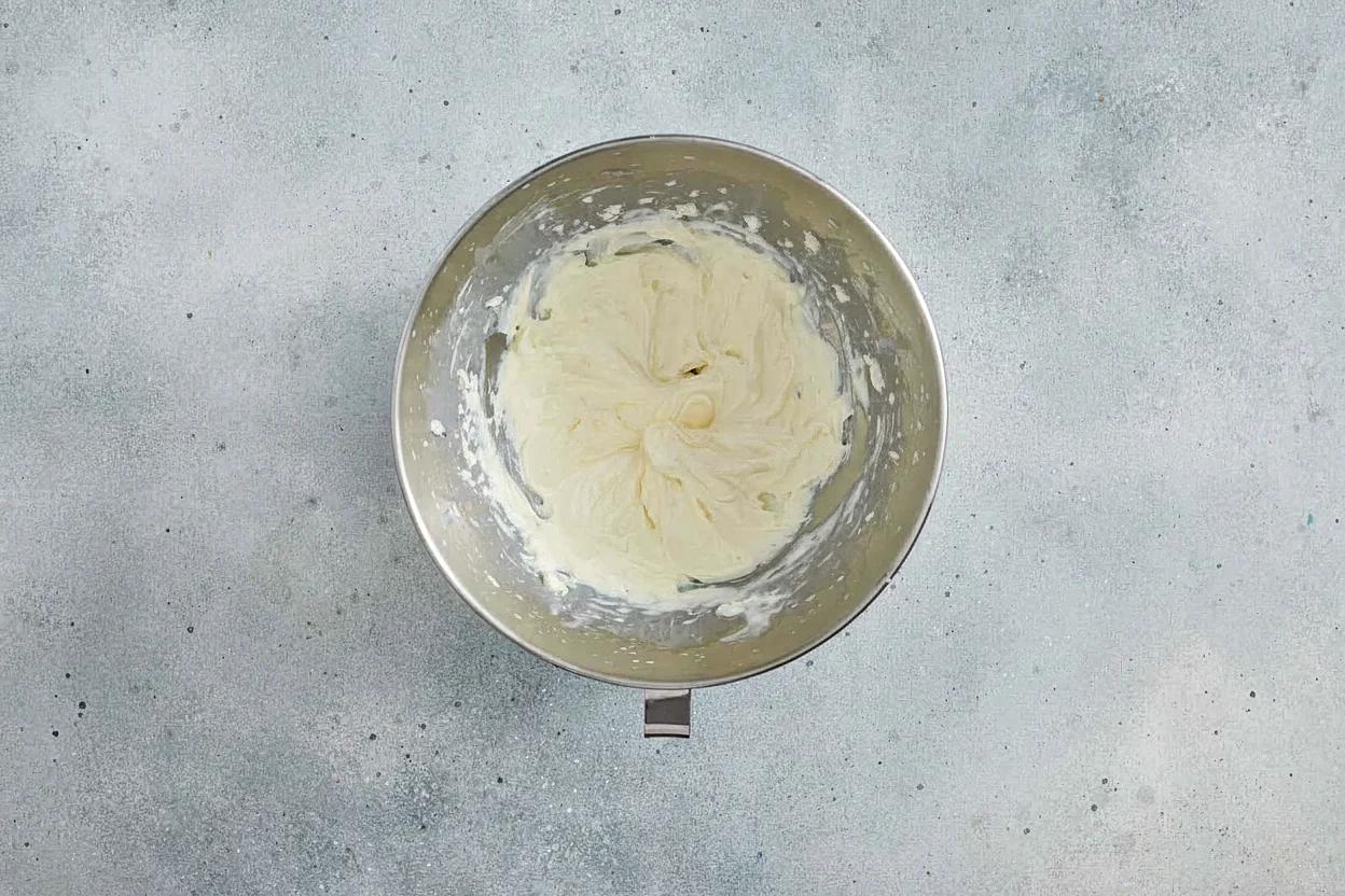 Whipped cream loaded into a piping bag with a star tip