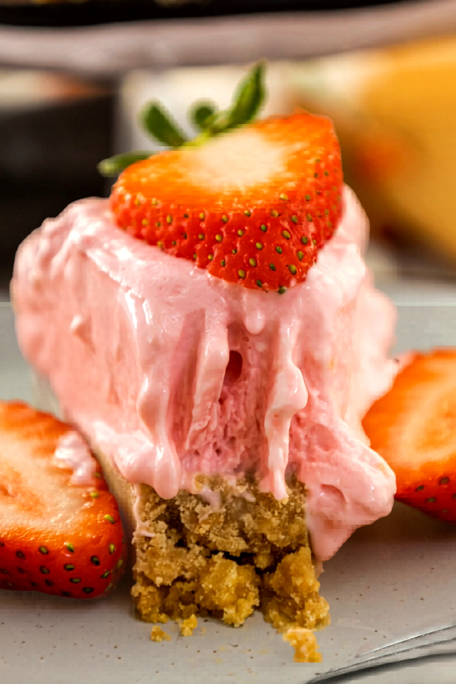 Extra close up of strawberry no bake cheesecake.