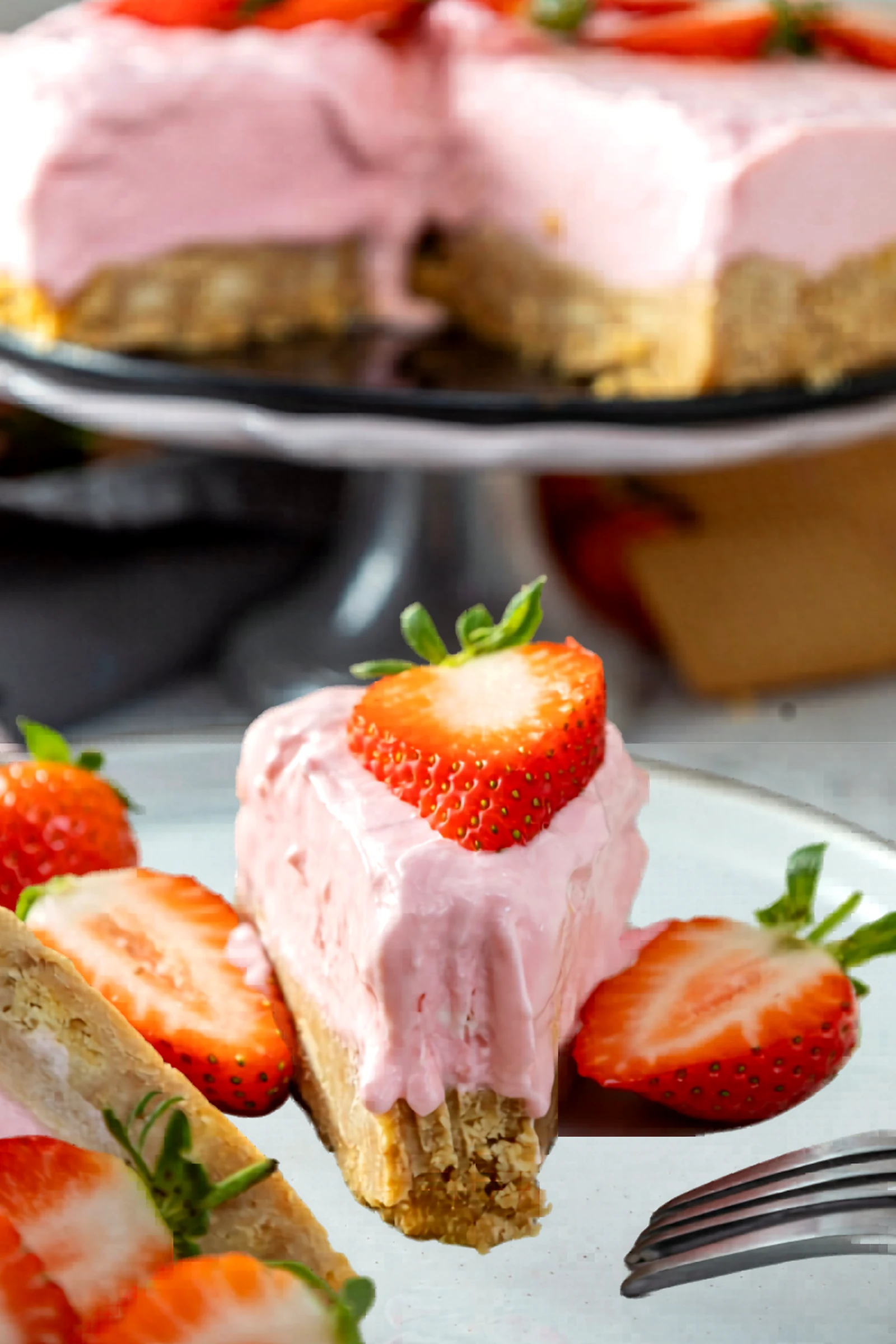 Close up of a slice of strawberry no bake cheesecake.
