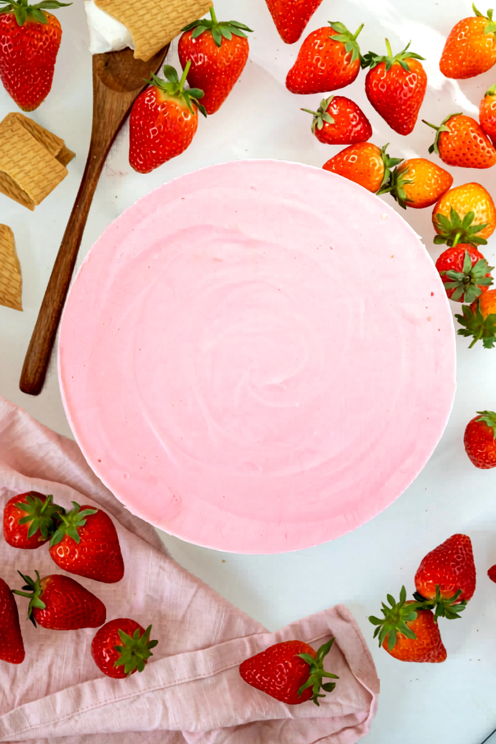 Chilled strawberry no bake cheesecake viewed from above.
