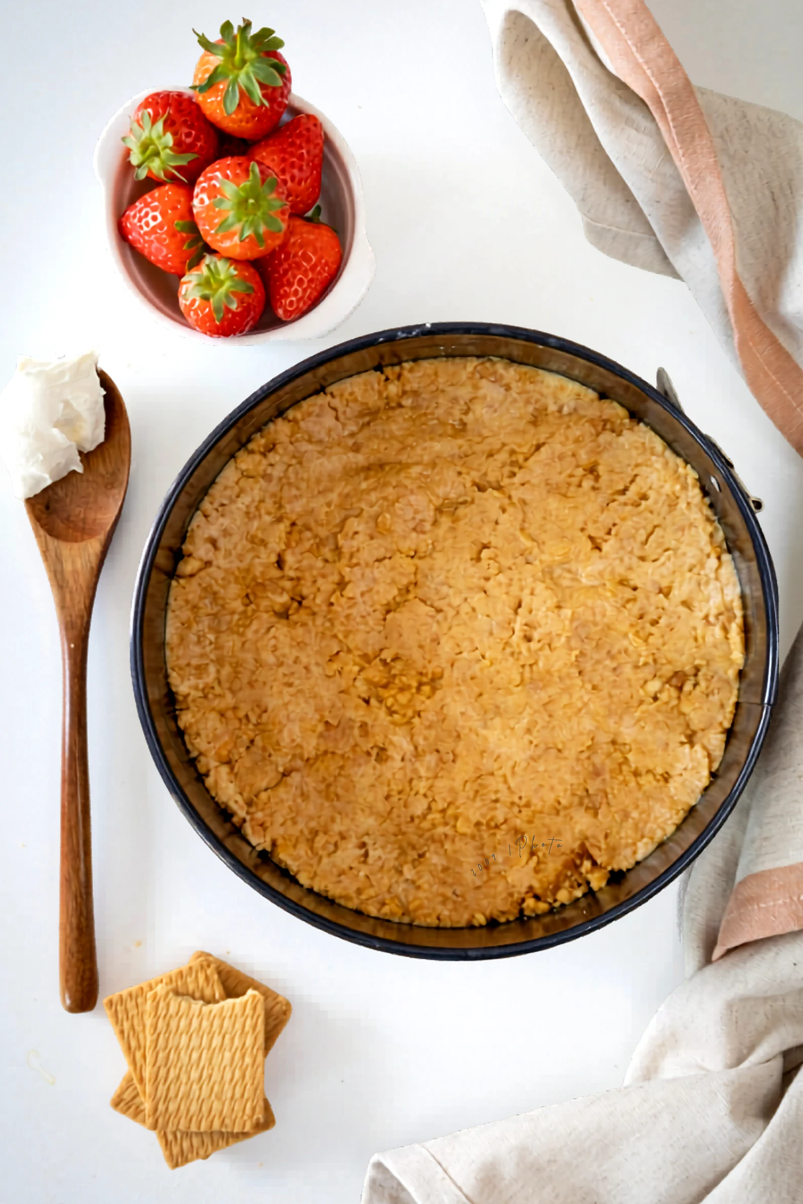 Crumb crust pressed into the bottom of a springform pan.