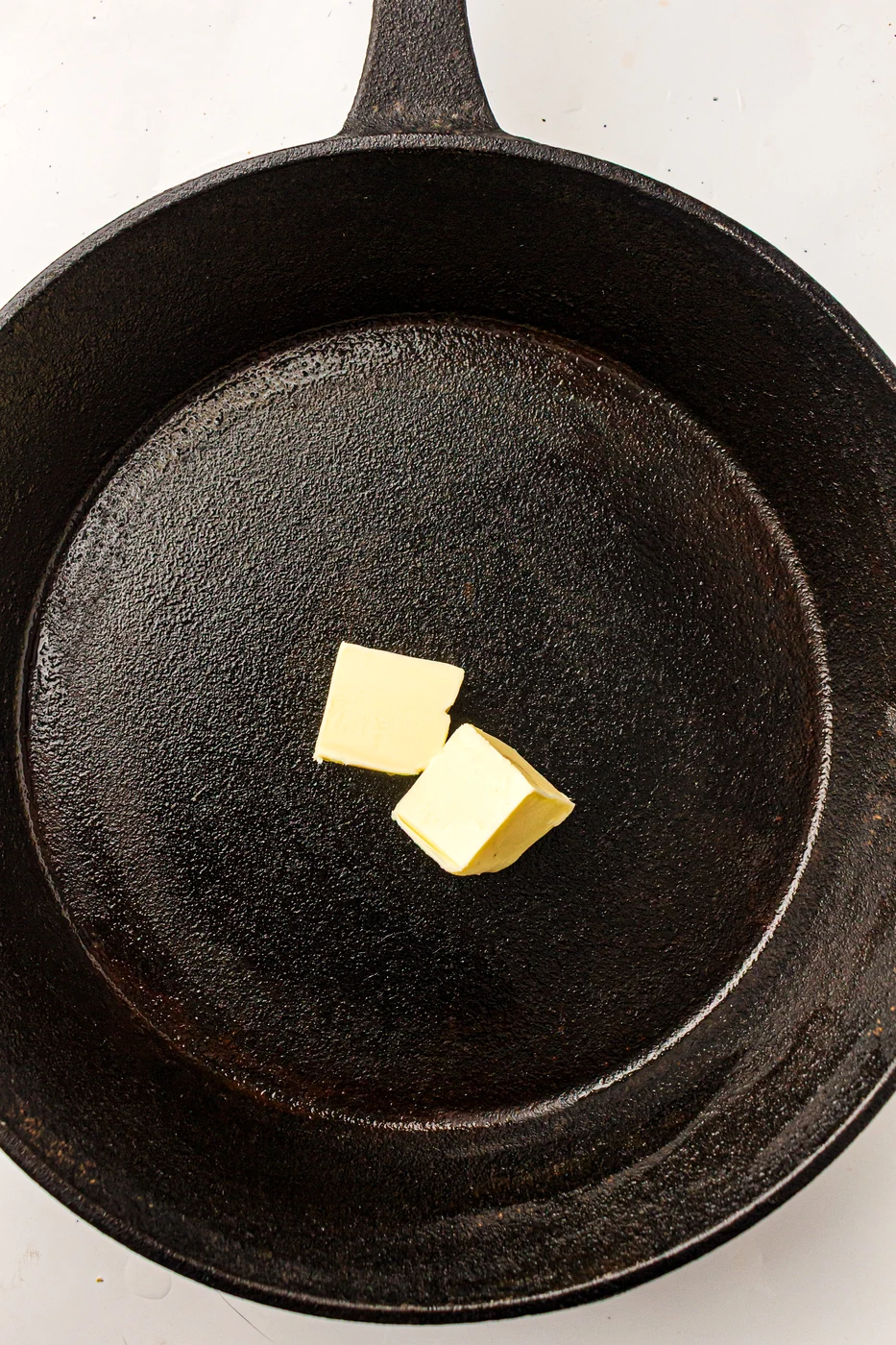 Butter melting in a cast-iron skillet