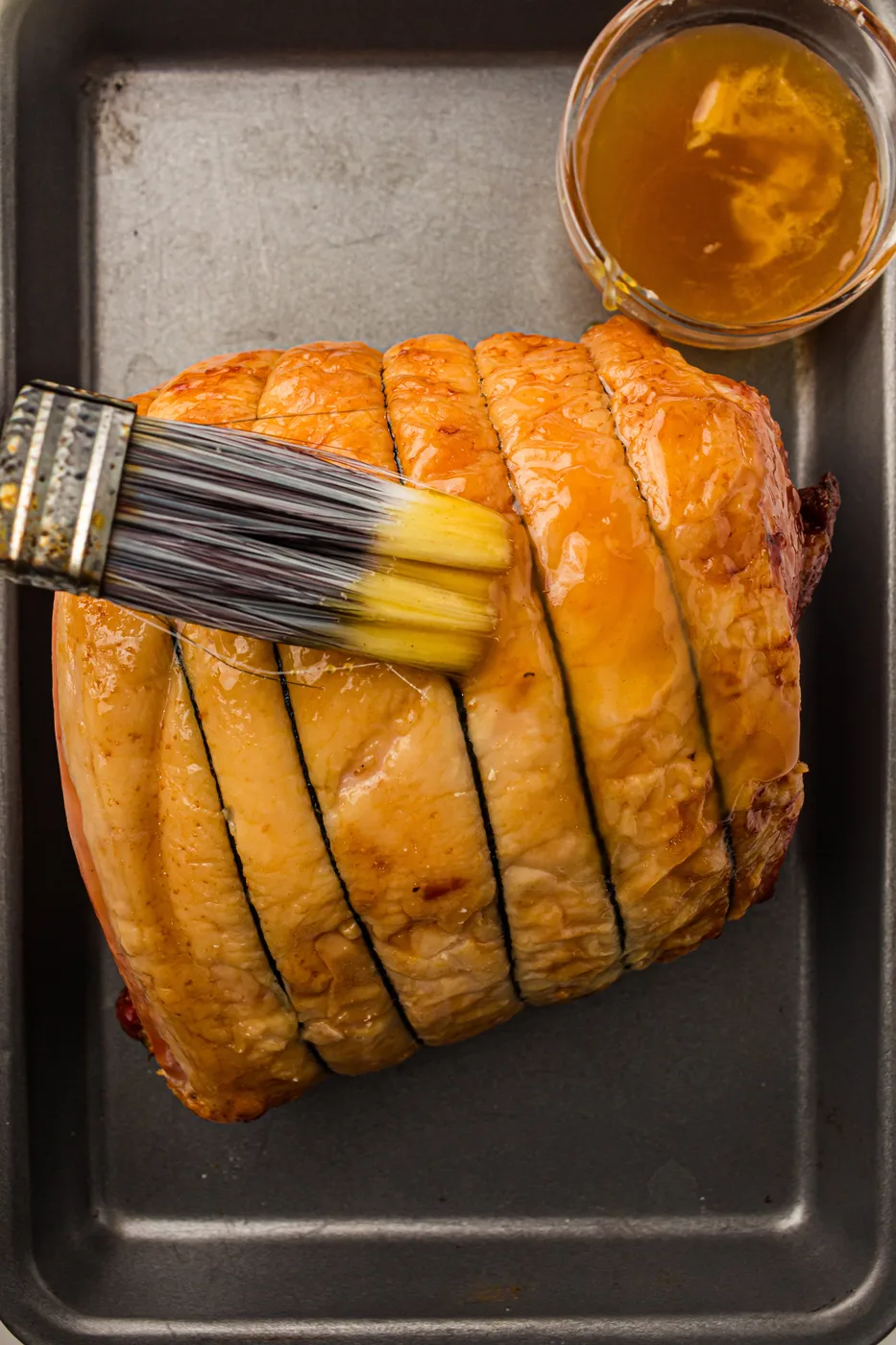 honey glazed spiral ham brushing