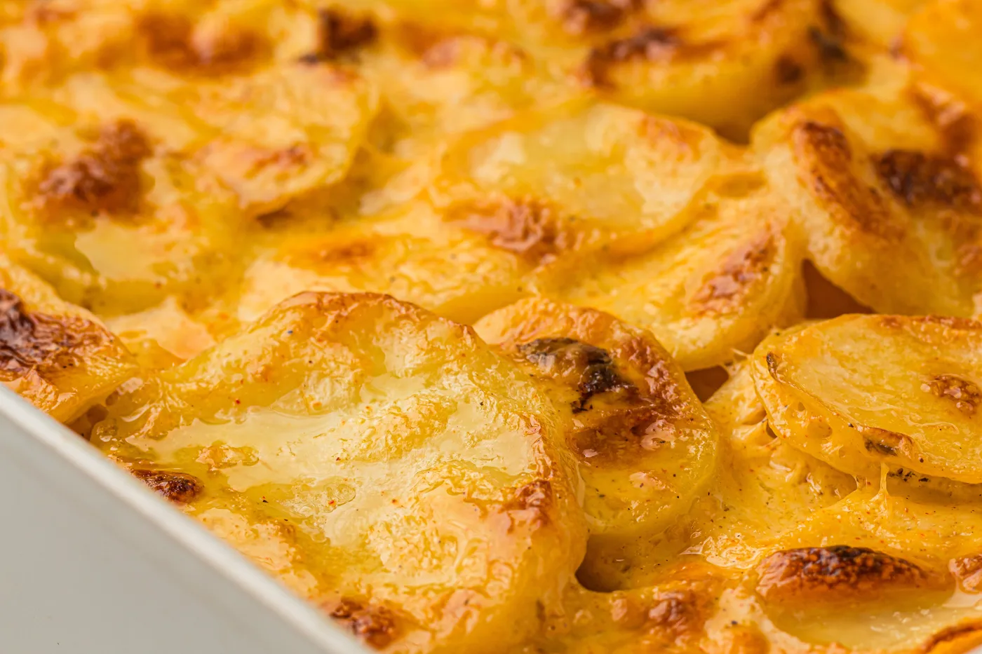 Close view of browned creamy scalloped potato layers