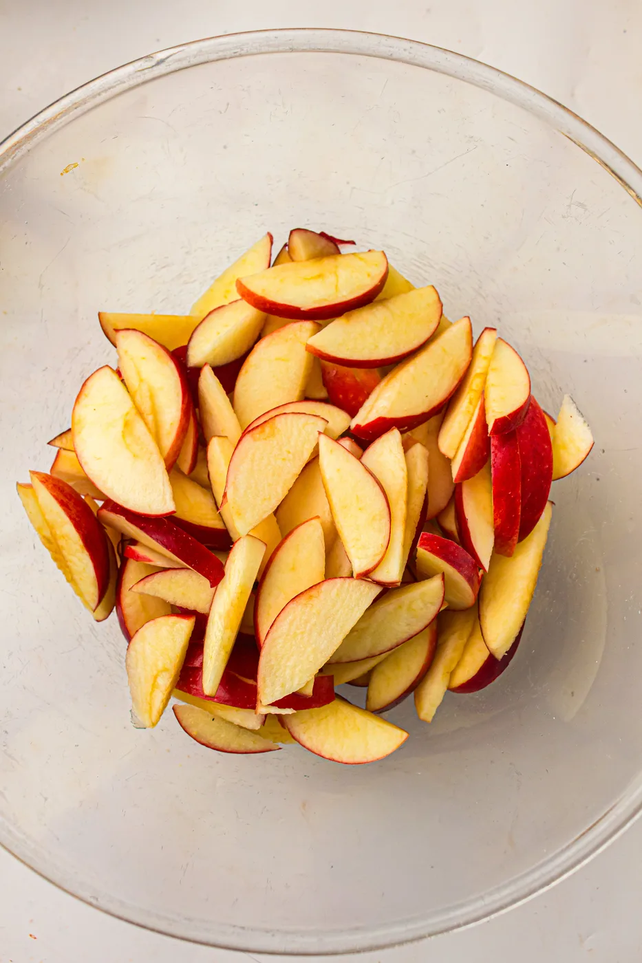 Unpeeled red apples cored and sliced into thin wedges
